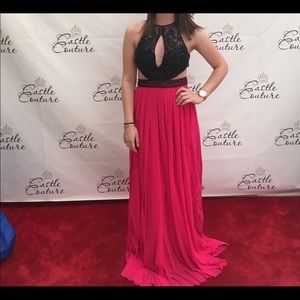 A black embroidered top and hot pink prom dress